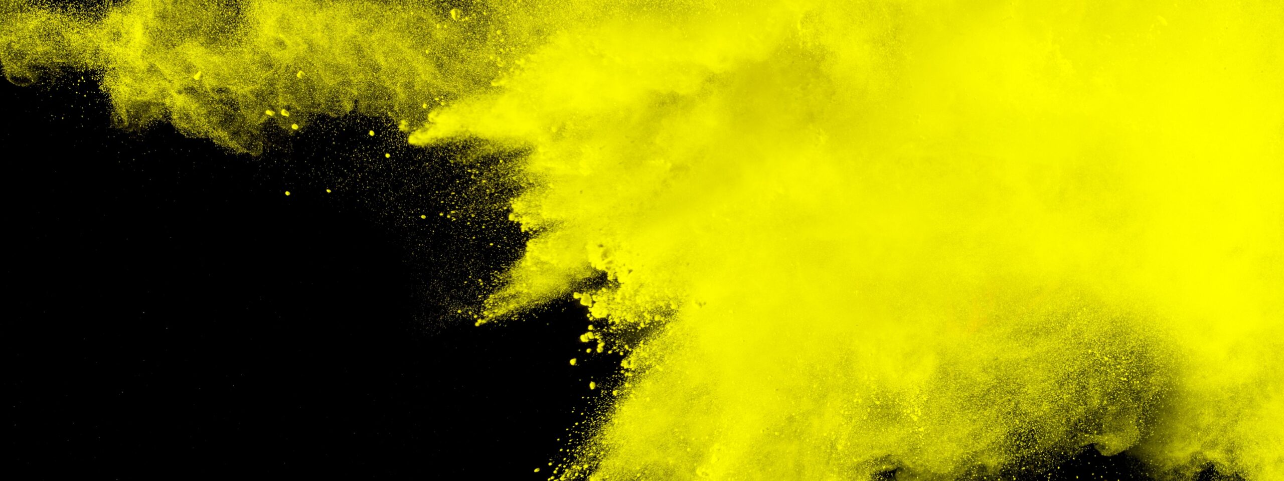abstract yellow dust explosion on black background