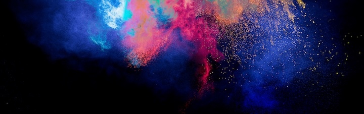 Throw color powder on dark background